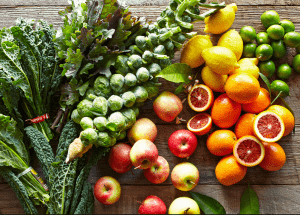 a group of fruits and vegetables on a wood surface Healthy Weight Loss Diets Stoke upon Trent